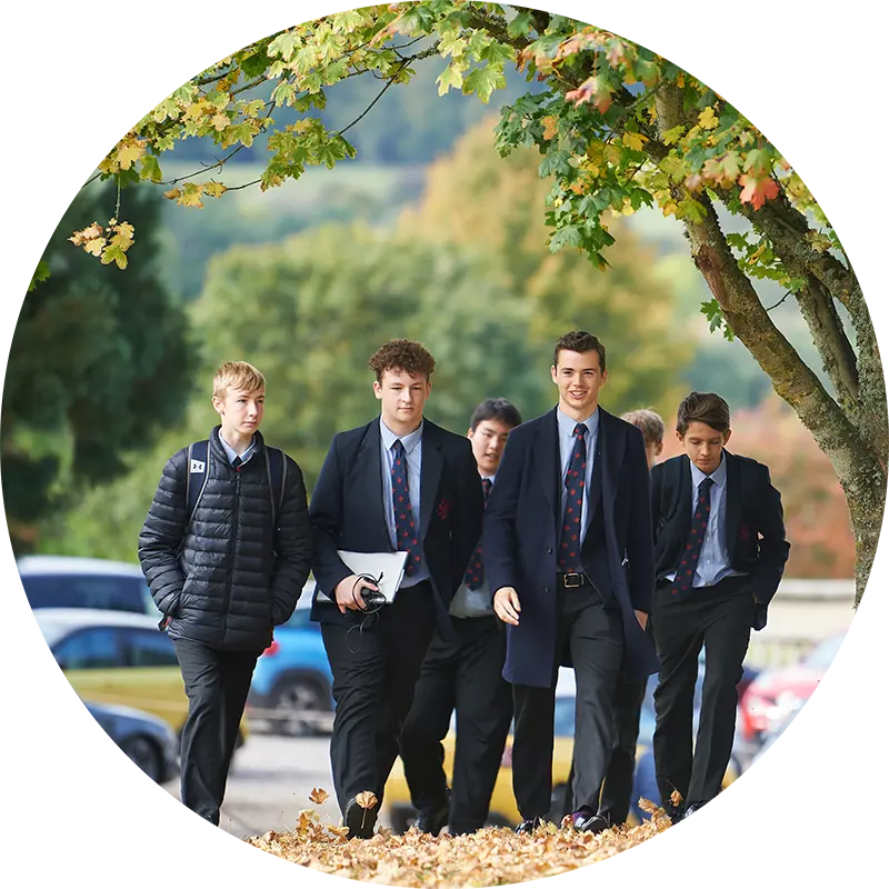 Rendcomb College pupils walking in the school grounds